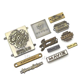 Rankinės metalinė logotipo plokštelė